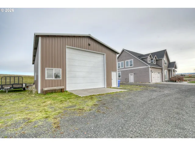 a backyard of a building with glass windows