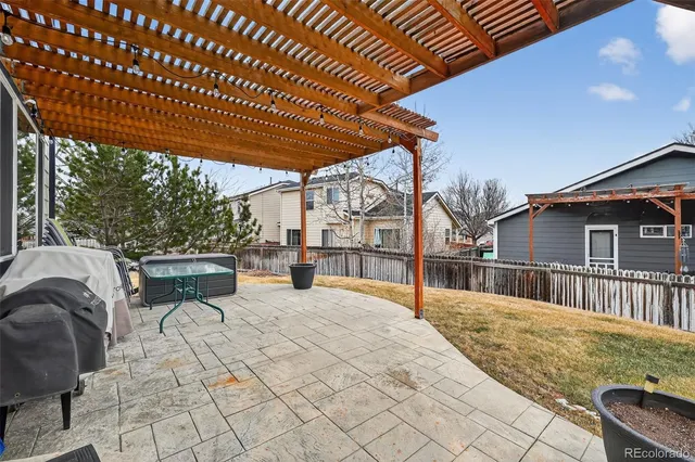a view of a backyard with sitting area