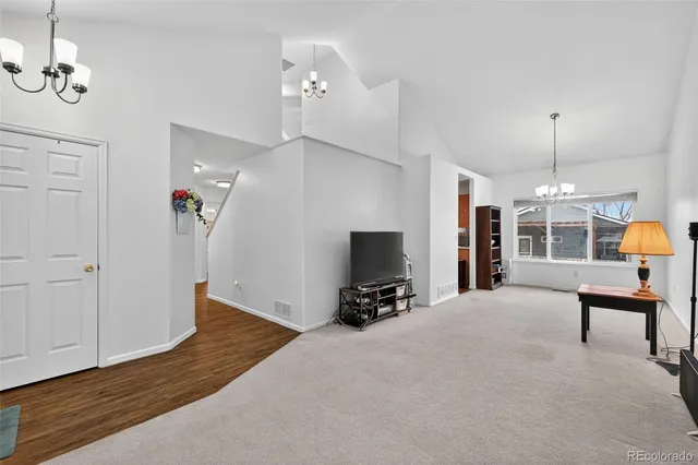 a bedroom with furniture and wooden floor