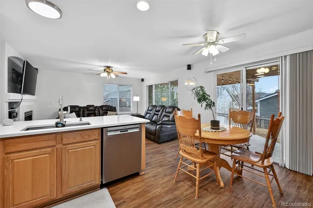 a view of a dining room with furniture and wooden floor