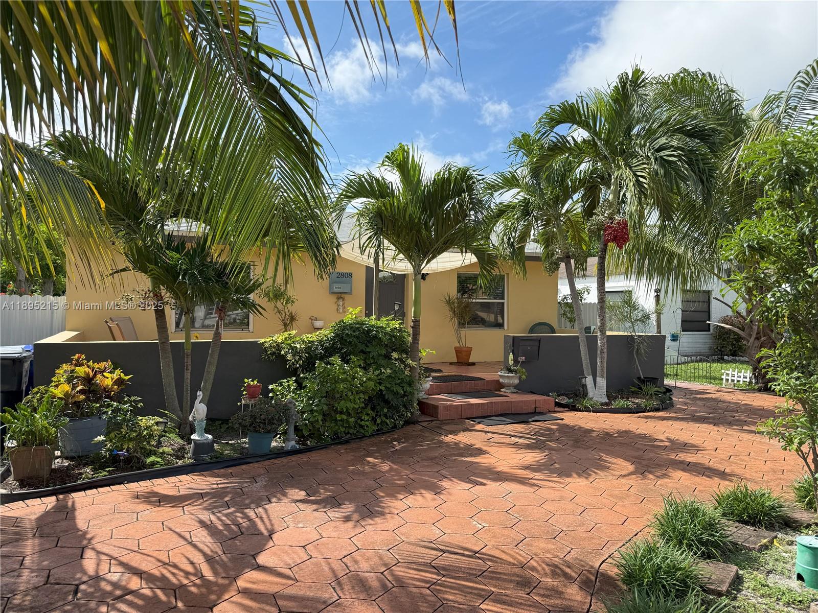 2808 Rodman Street Hollywood, FL 33020 - Photo 19 of 19 a view of a backyard with palm trees
