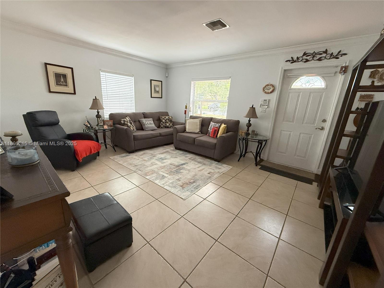 2808 Rodman Street Hollywood, FL 33020 - Photo 4 of 19 a living room with furniture and a window