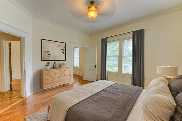 a bedroom with a bed and a dresser