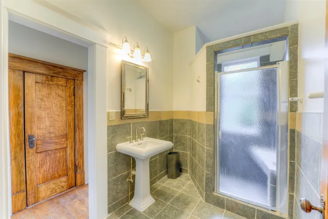 a bathroom with a sink and mirror