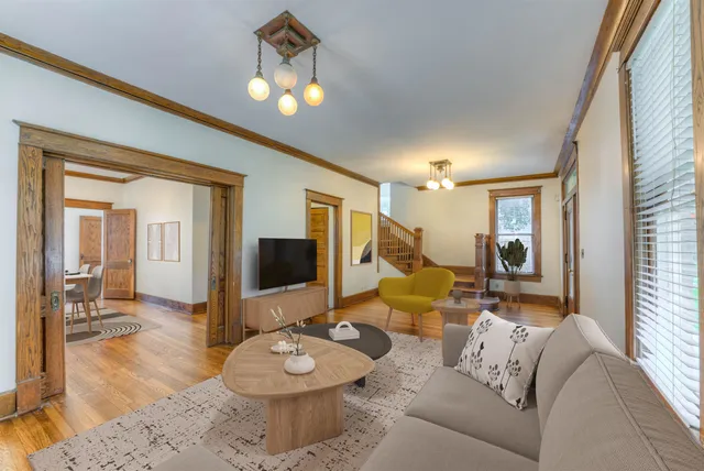 a living room with furniture and a flat screen tv