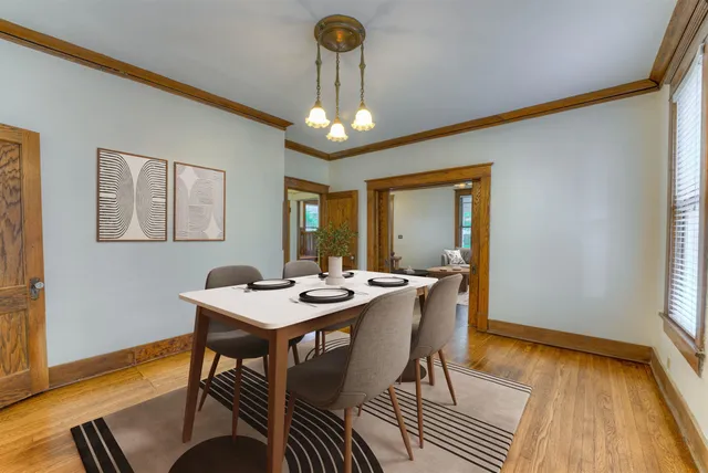 a view of a dining room with furniture window and wooden floor