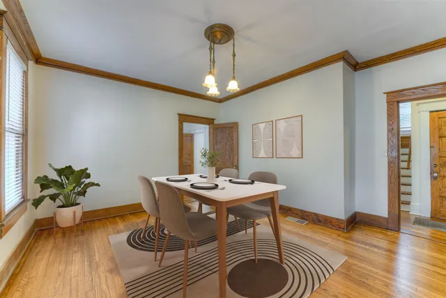 a view of a livingroom with furniture window and wooden floor