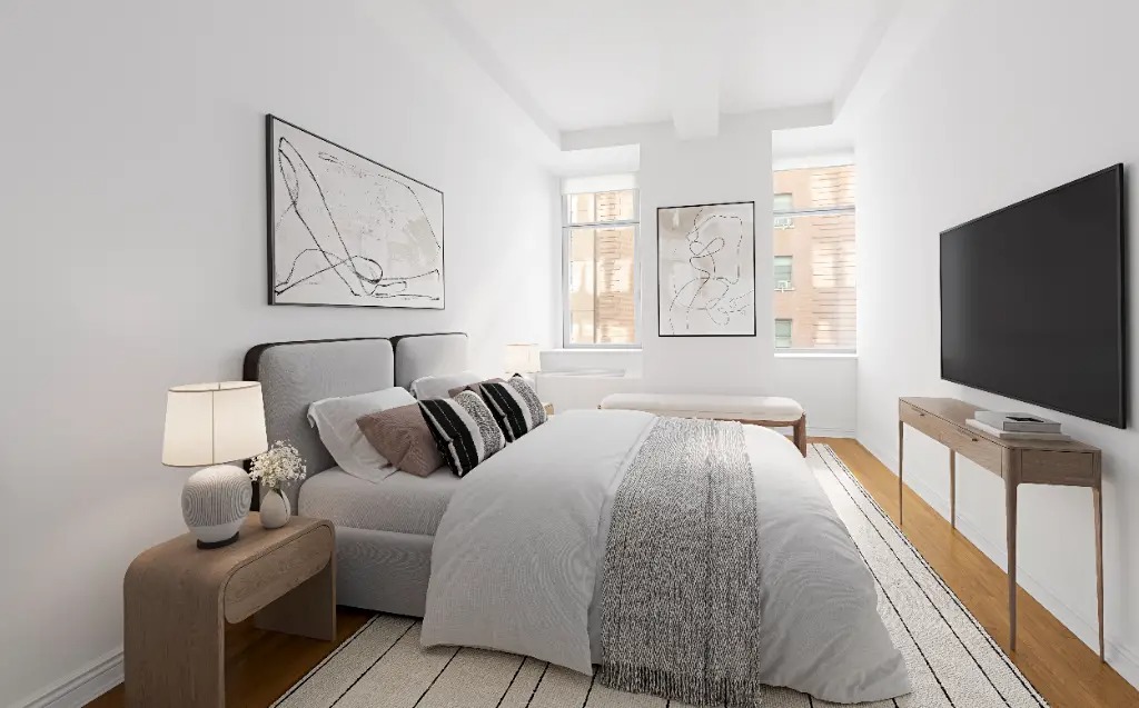 252 7th Avenue, Unit 5T Manhattan, NY 10001 - Photo 4 of 7 a living room with furniture and a flat screen tv