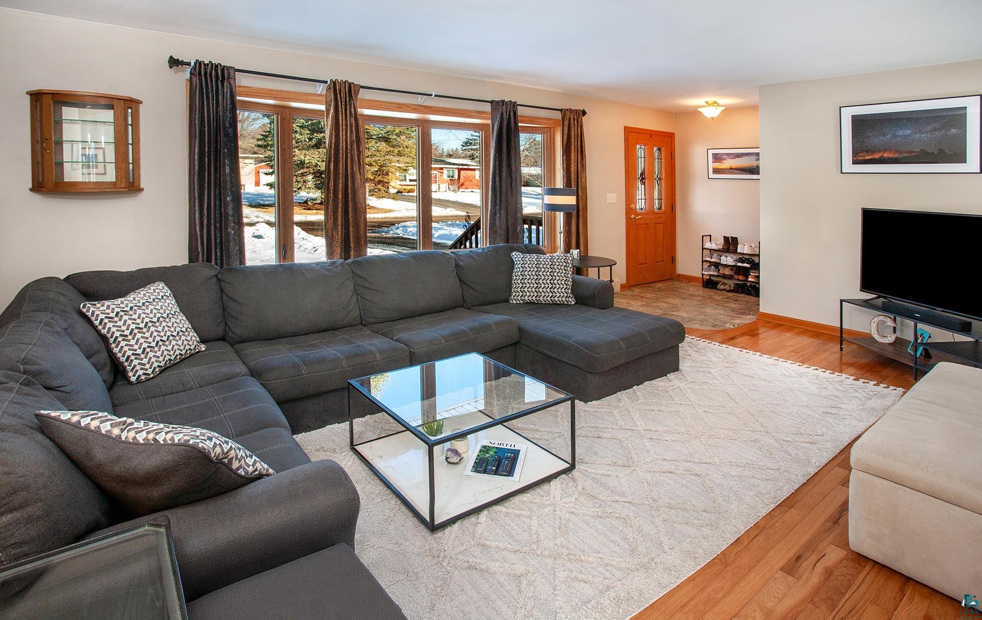 318 Marshall Street Duluth, MN 55803 - Photo 9 of 18 Living room with hardwood / wood-style floors and a healthy amount of sunlight