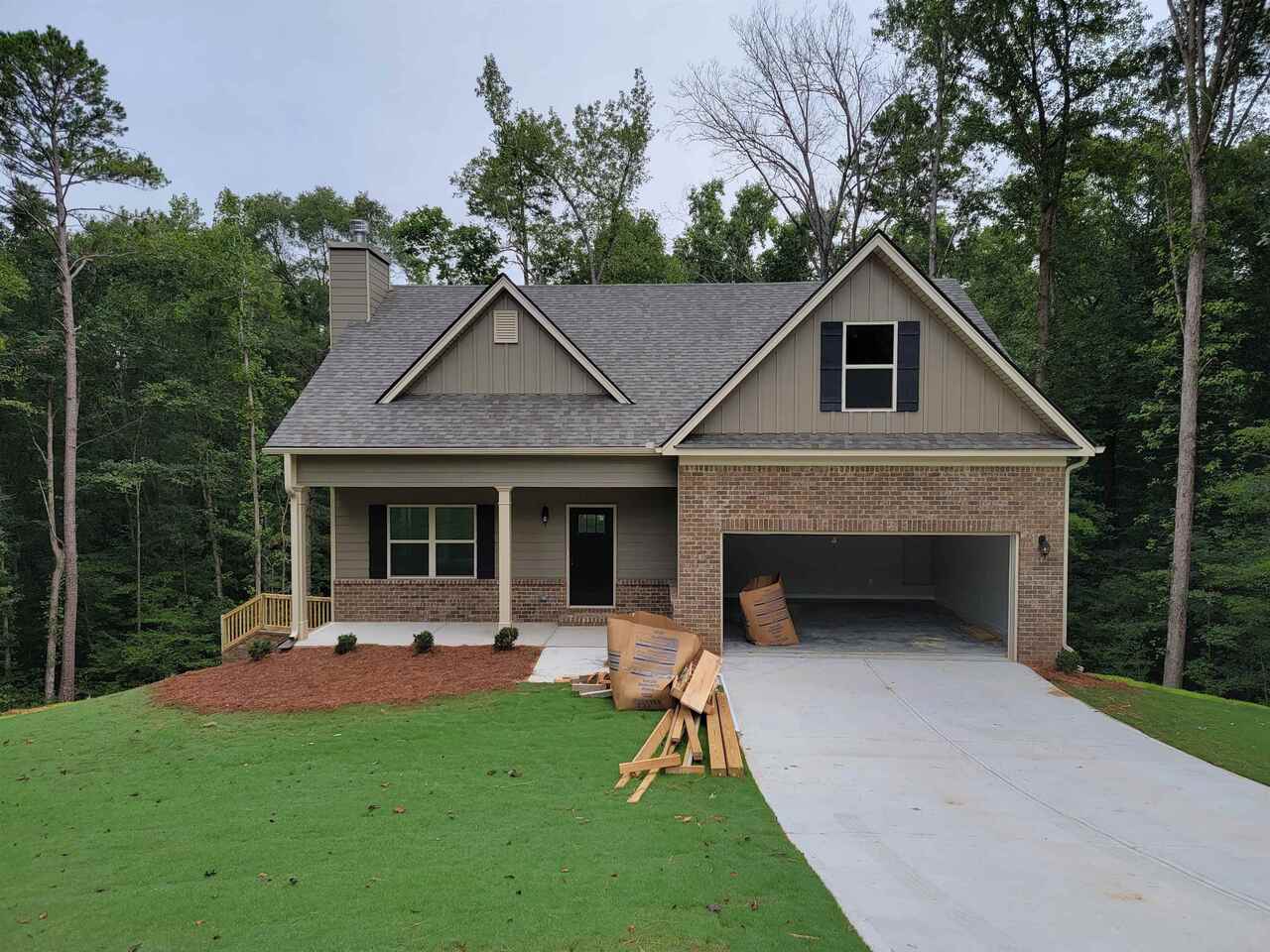 200 Morgan Way, Unit 38 Colbert, GA 30628 - Photo 1 of 1 a front view of a house with a yard and porch