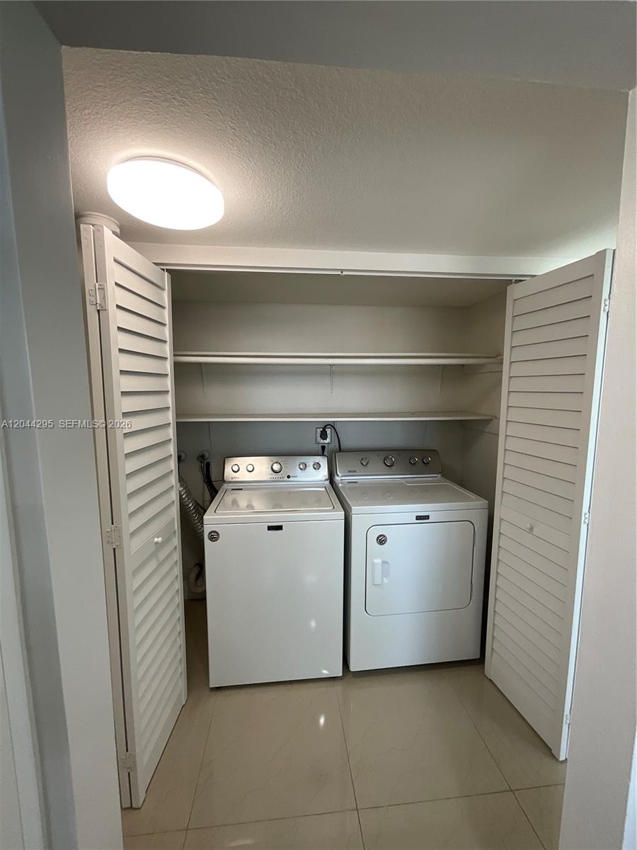 9441 Southwest 4th Street, Unit 214 Miami, FL 33174 - Photo 11 of 22 a utility room with washer and dryer