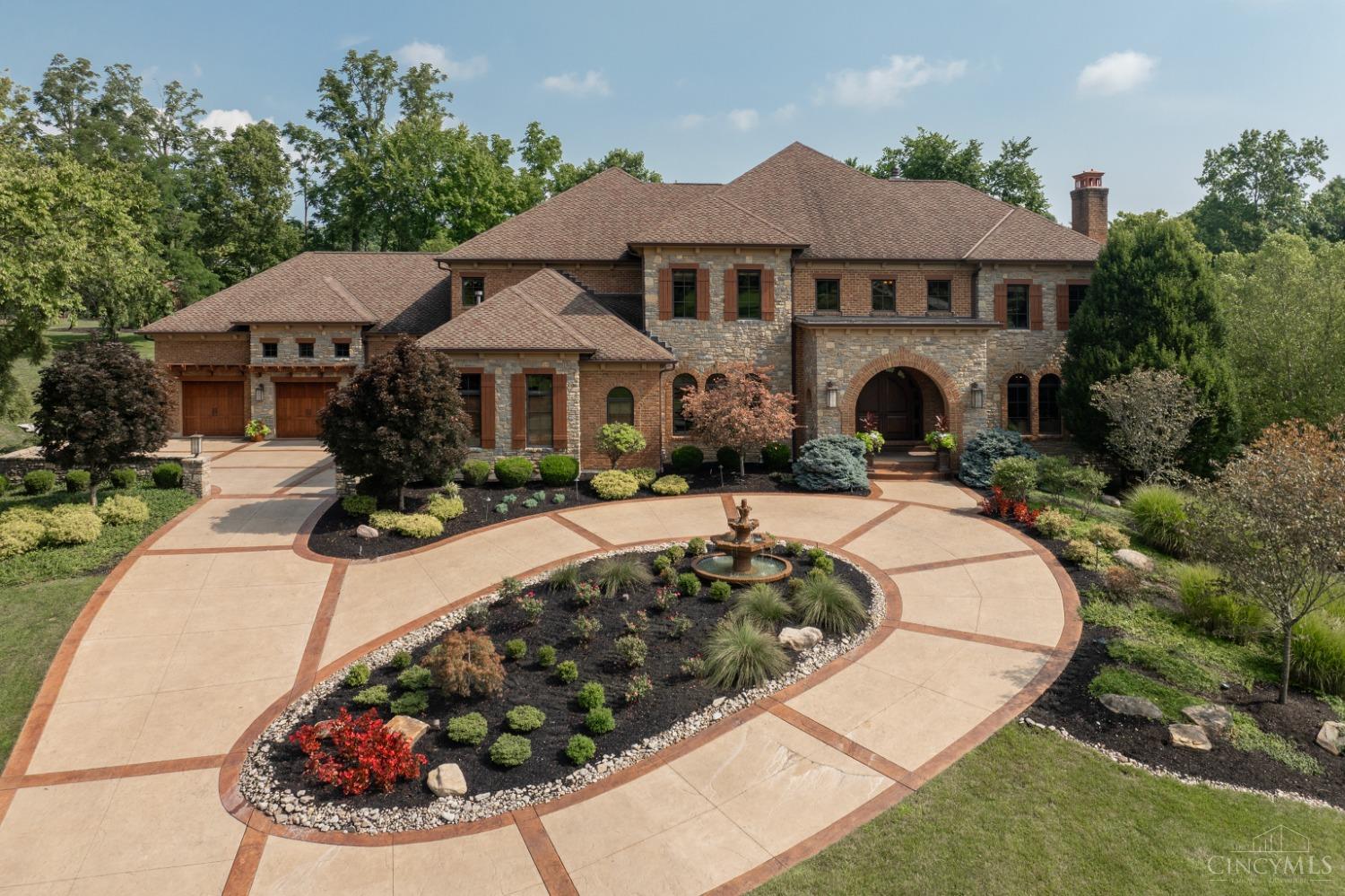 5900 Park Road Cincinnati, OH 45243 - Photo 2 of 50 Aerial View of front of residence featuring a stamped concrete circular drive, fountain, and beautiful landscaping.