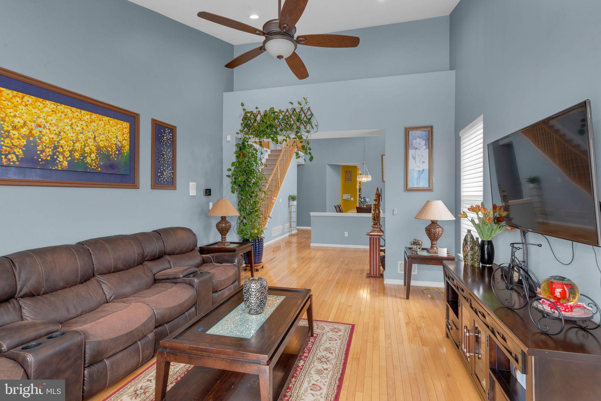 16 Cardiff Court Princeton Junction, NJ 08550 - Photo 7 of 60 a living room with furniture and a flat screen tv