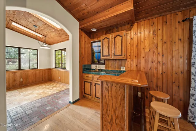 a view of bathroom with a sink and mirror