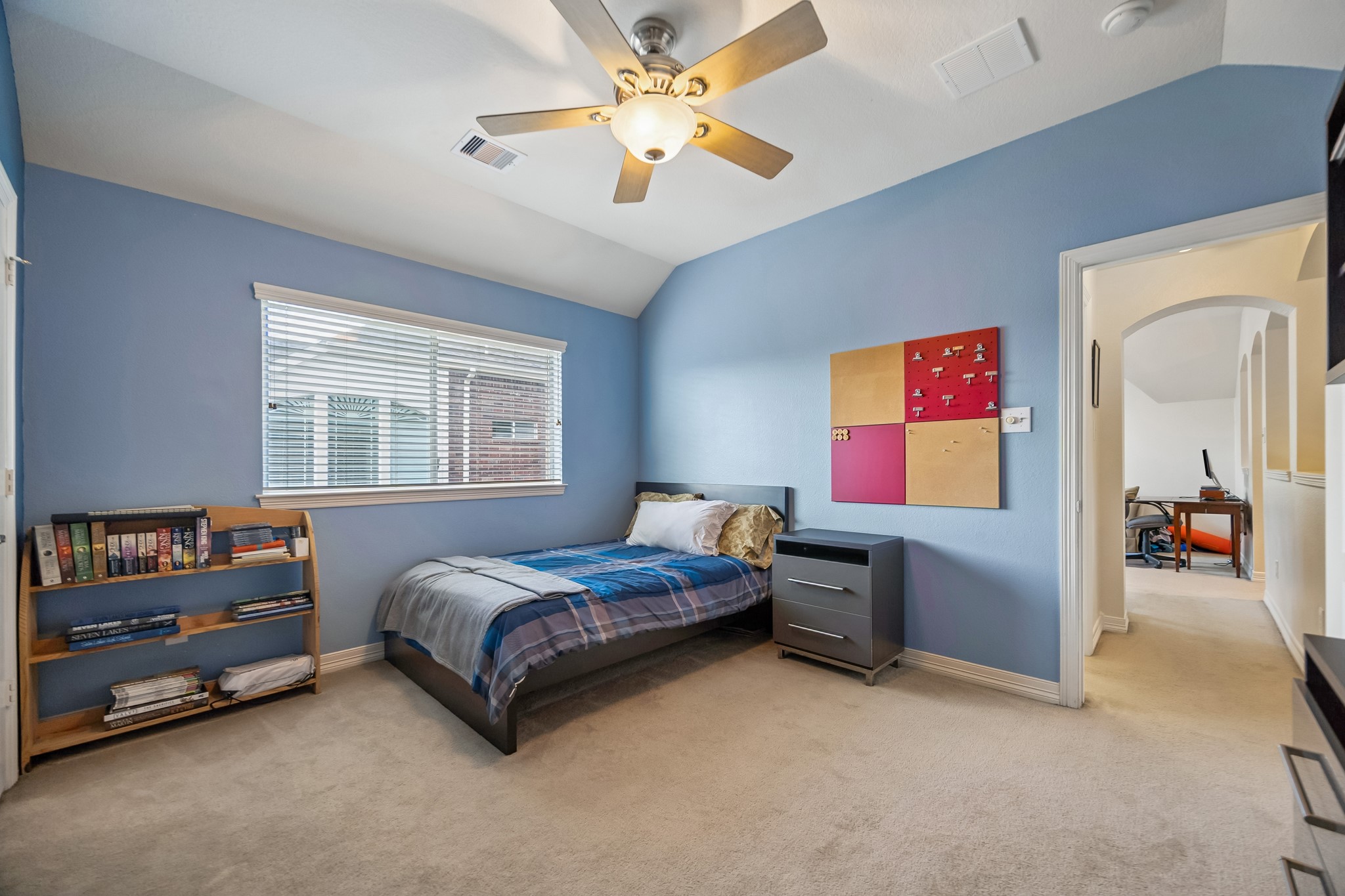 5718 Brennan Ridge Lane Katy, TX 77450 - Photo 28 of 42 PRIVATE THIRD UPSTAIRS BEDROOM: Ideally positioned near the game room, this spacious bedroom offers vaulted ceilings, abundant natural light, and the flexibility to serve as a guest suite, study space, or private retreat.