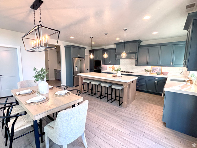 429 East Treasure Road Washington, UT 84780 - Photo 10 of 20 Modern kitchen and dining area featuring light wood-finish flooring
