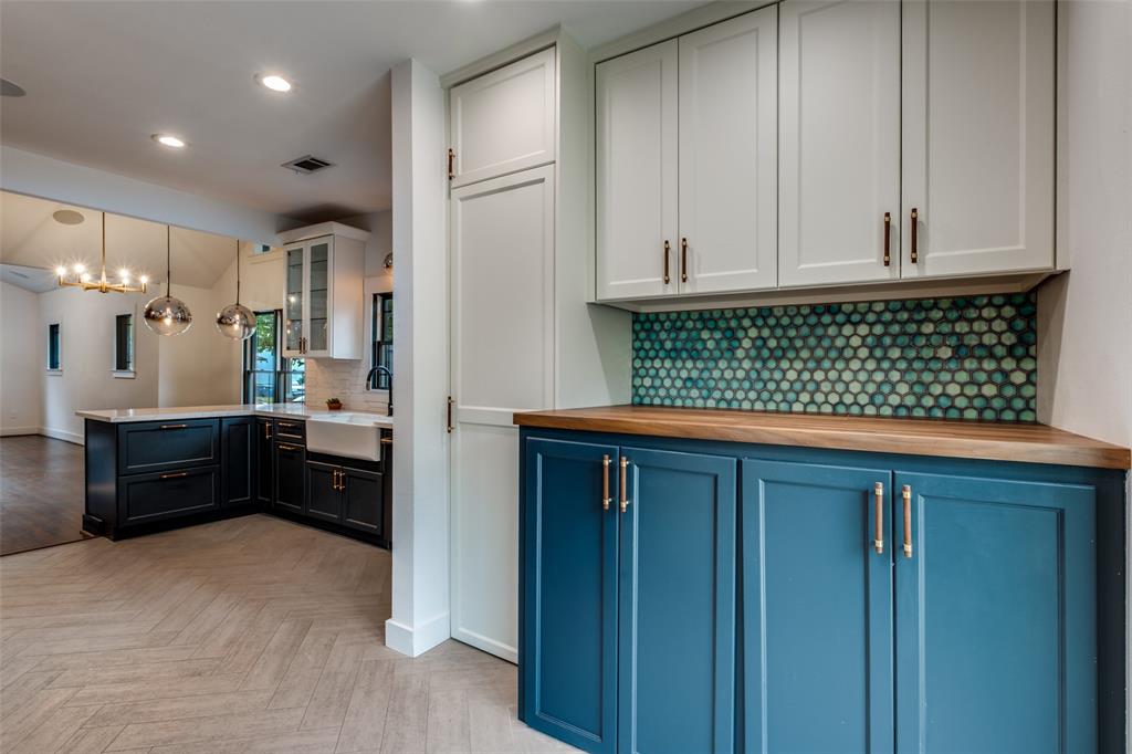 5819 Prospect Avenue Dallas, TX 75206 - Photo 15 of 25 a kitchen with stainless steel appliances granite countertop a stove a cabinets and a refrigerator