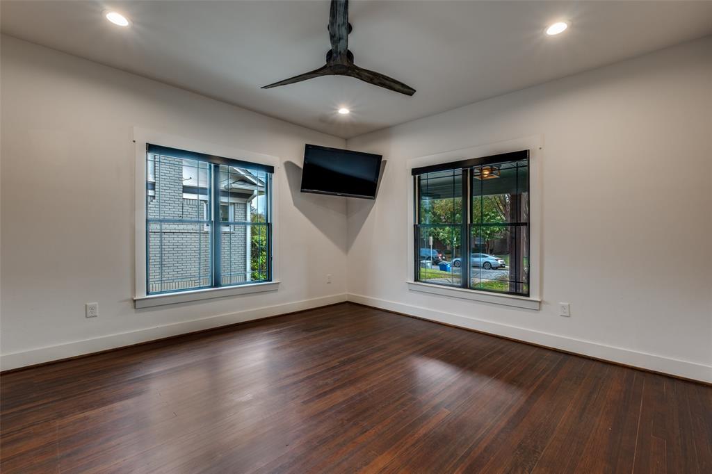 5819 Prospect Avenue Dallas, TX 75206 - Photo 16 of 25 an empty room with wooden floor and windows