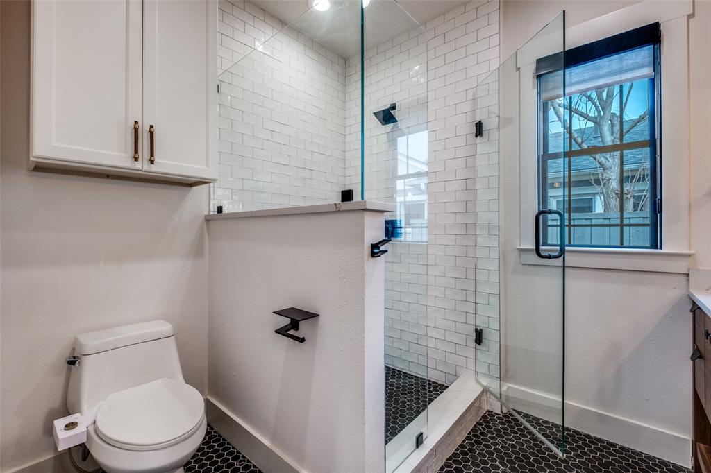 5819 Prospect Avenue Dallas, TX 75206 - Photo 18 of 25 a bathroom with a toilet and a shower