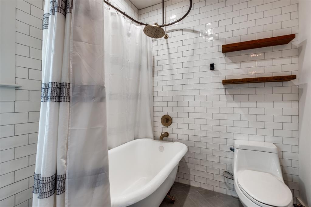 5819 Prospect Avenue Dallas, TX 75206 - Photo 20 of 25 a bathroom with a toilet and shower