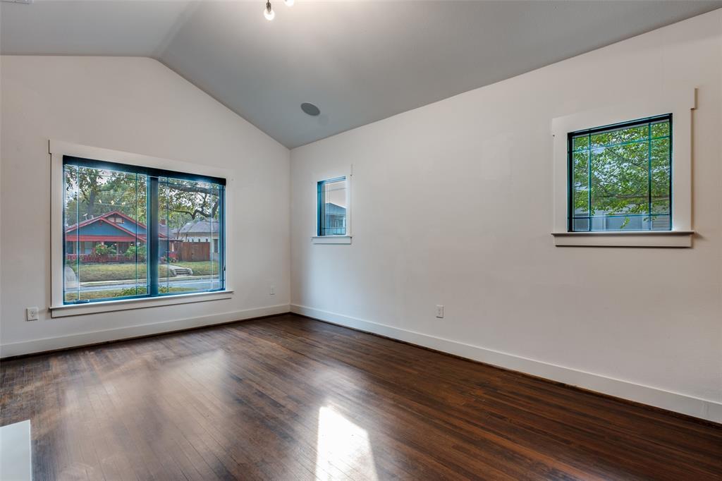 5819 Prospect Avenue Dallas, TX 75206 - Photo 8 of 25 a view of an empty room with wooden floor and a window