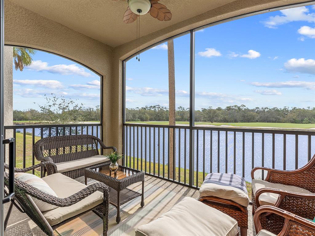 17108 Vardon Terrace, Unit 203 Lakewood Ranch, FL 34211 - Photo 2 of 50 a balcony with wooden floor