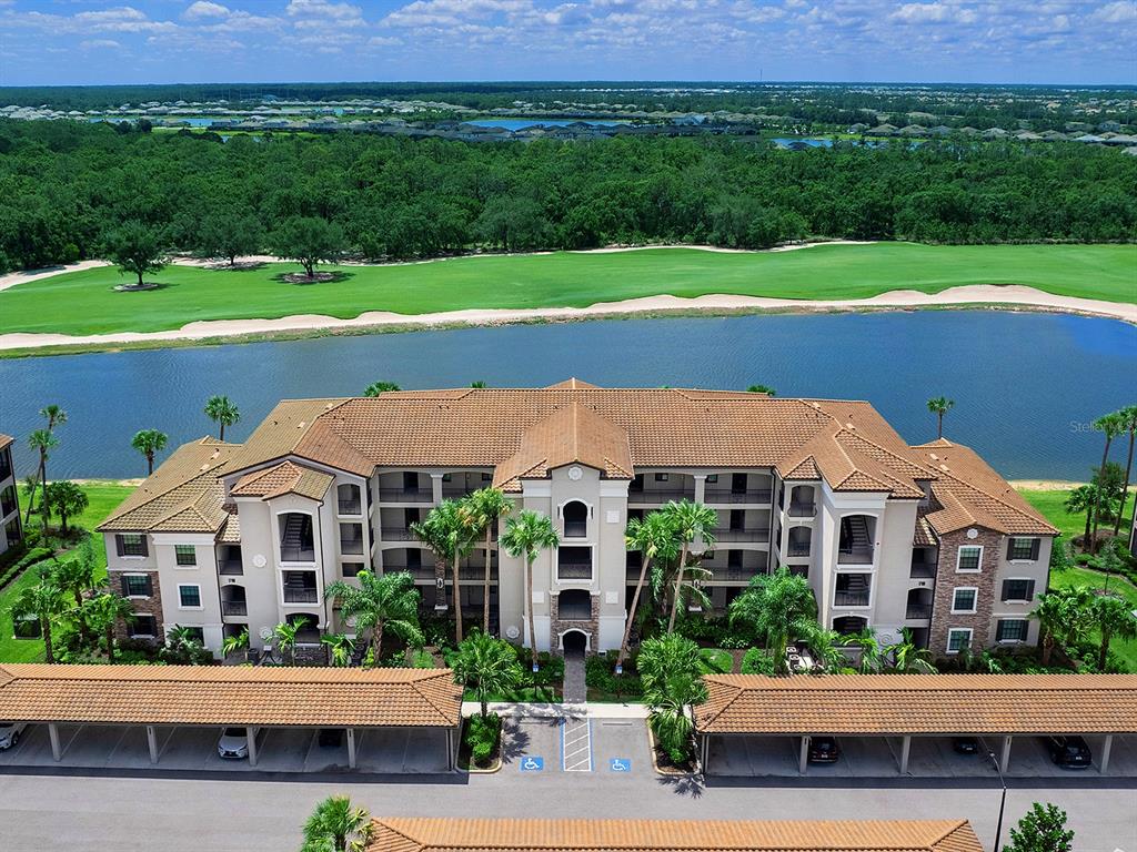 17108 Vardon Terrace, Unit 203 Lakewood Ranch, FL 34211 - Photo 3 of 50 a front view of house with yard and green space