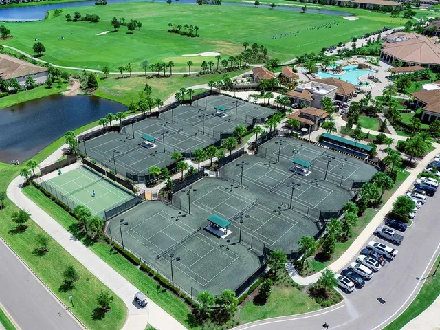 an aerial view of a residential houses with outdoor space