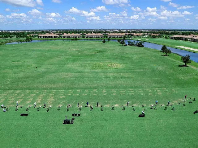 a view of a golf course with a big yard