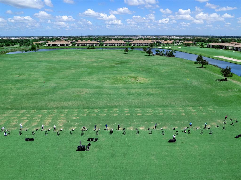 17108 Vardon Terrace, Unit 203 Lakewood Ranch, FL 34211 - Photo 40 of 50 a view of a golf course with a big yard