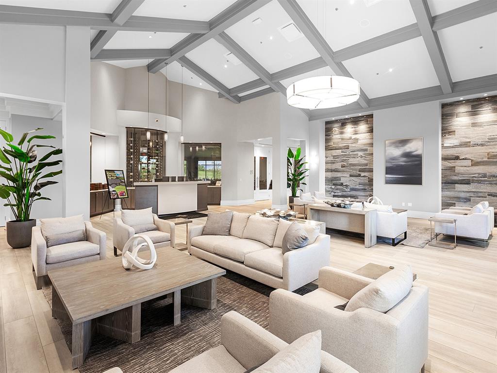 17108 Vardon Terrace, Unit 203 Lakewood Ranch, FL 34211 - Photo 43 of 50 a living room with furniture and wooden floor