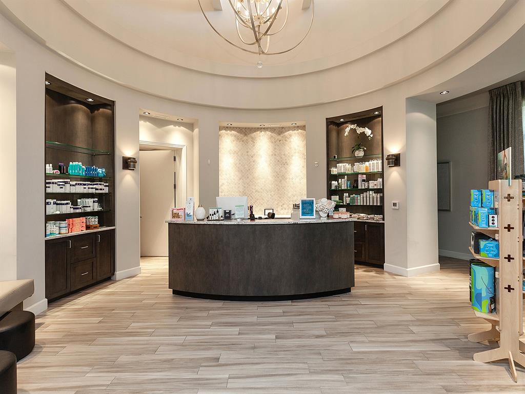 17108 Vardon Terrace, Unit 203 Lakewood Ranch, FL 34211 - Photo 45 of 50 a living room with hard wood flooring and a kitchen