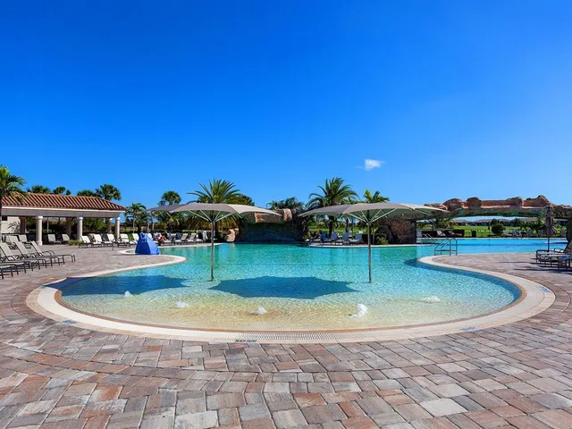 a view of swimming pool with outdoor seating