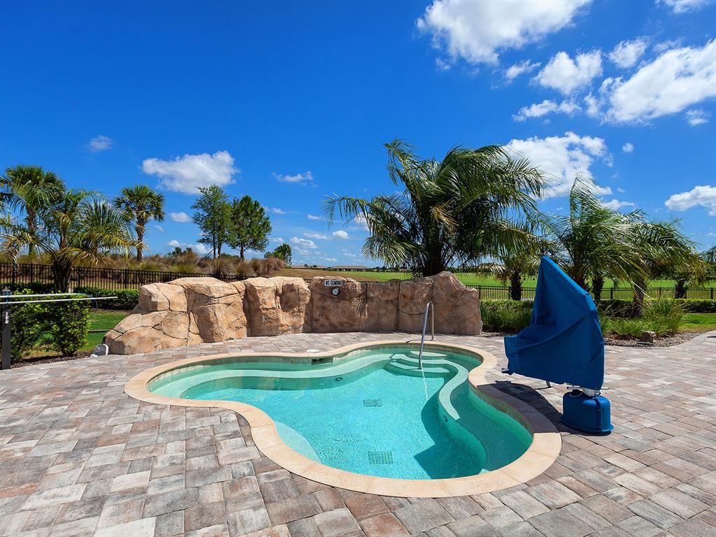 17108 Vardon Terrace, Unit 203 Lakewood Ranch, FL 34211 - Photo 50 of 50 a view of a swimming pool with a yard