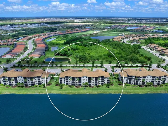 an aerial view of a house with a swimming pool