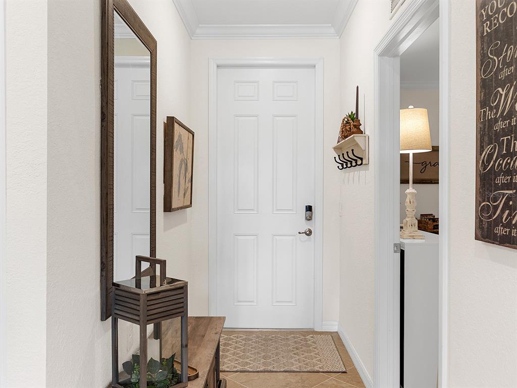 17108 Vardon Terrace, Unit 203 Lakewood Ranch, FL 34211 - Photo 6 of 50 a view of an entryway with wooden floor