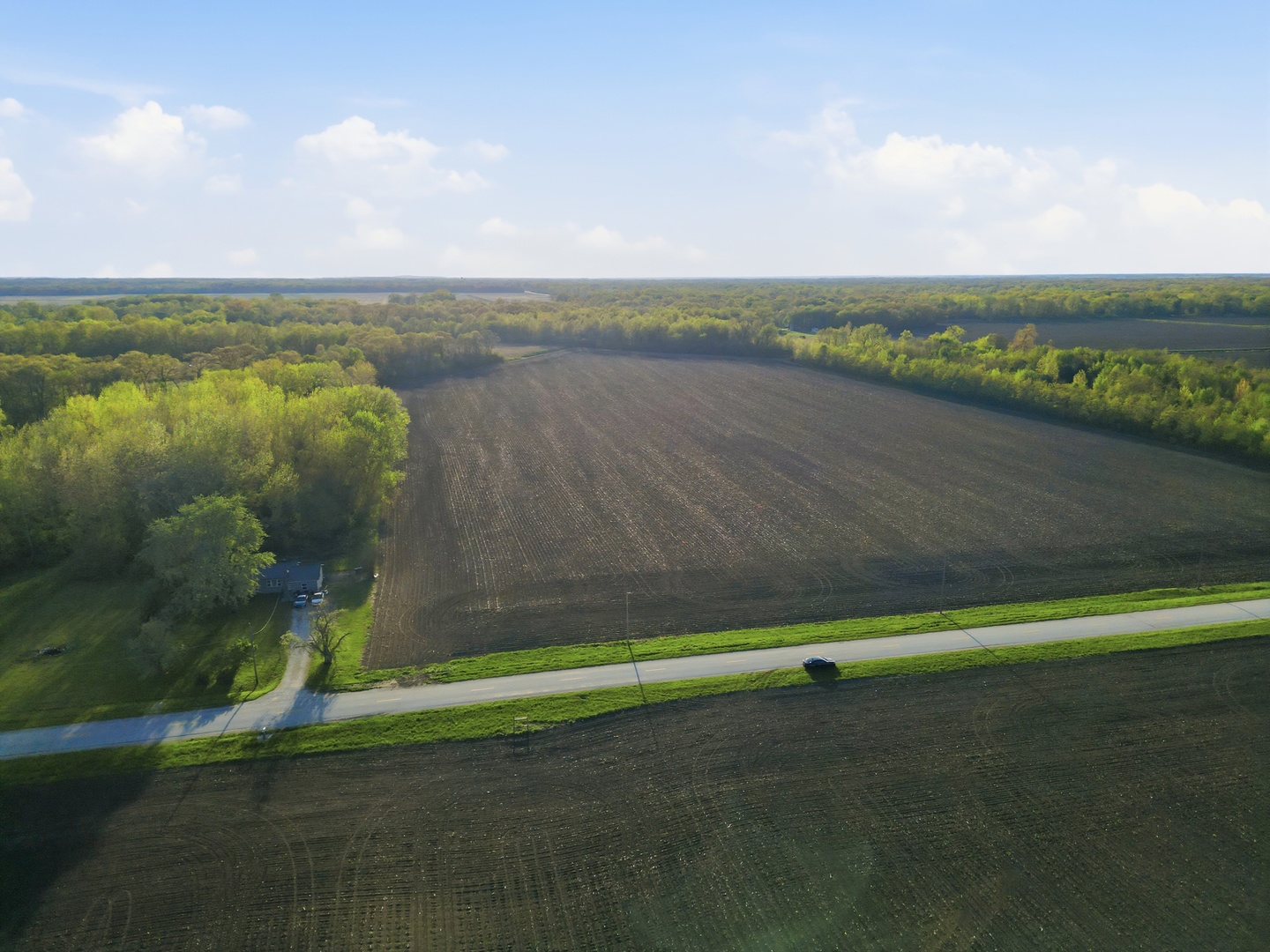 4476 South 16000E Road Pembroke Township, IL 60958 - Photo 5 of 13 a view of a lake with a big yard