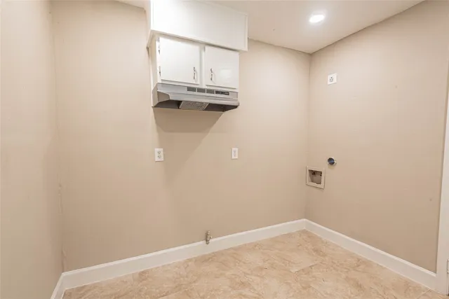 an empty room with cabinet