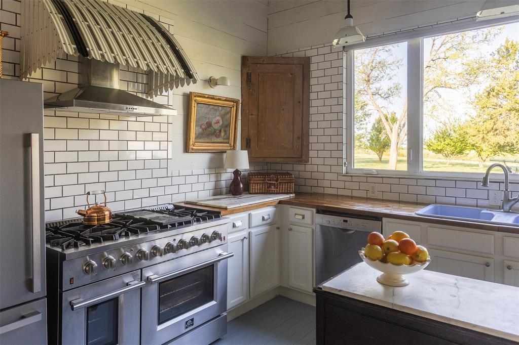 3183 Harrell Road Howe, TX 75459 - Photo 13 of 40 a kitchen with a stove and a sink
