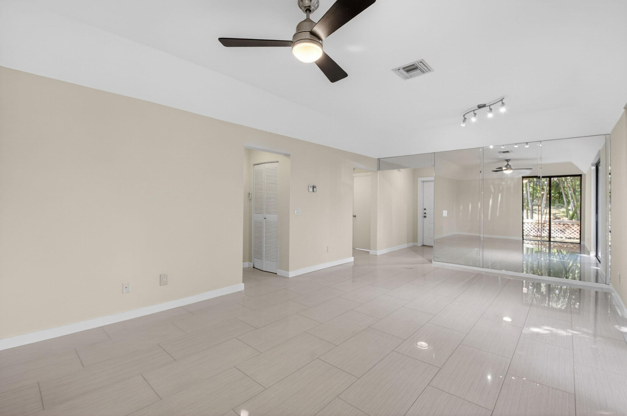5845 Fox Hollow Drive, Unit A Boca Raton, FL 33486 - Photo 11 of 50 a view of an empty room with a window