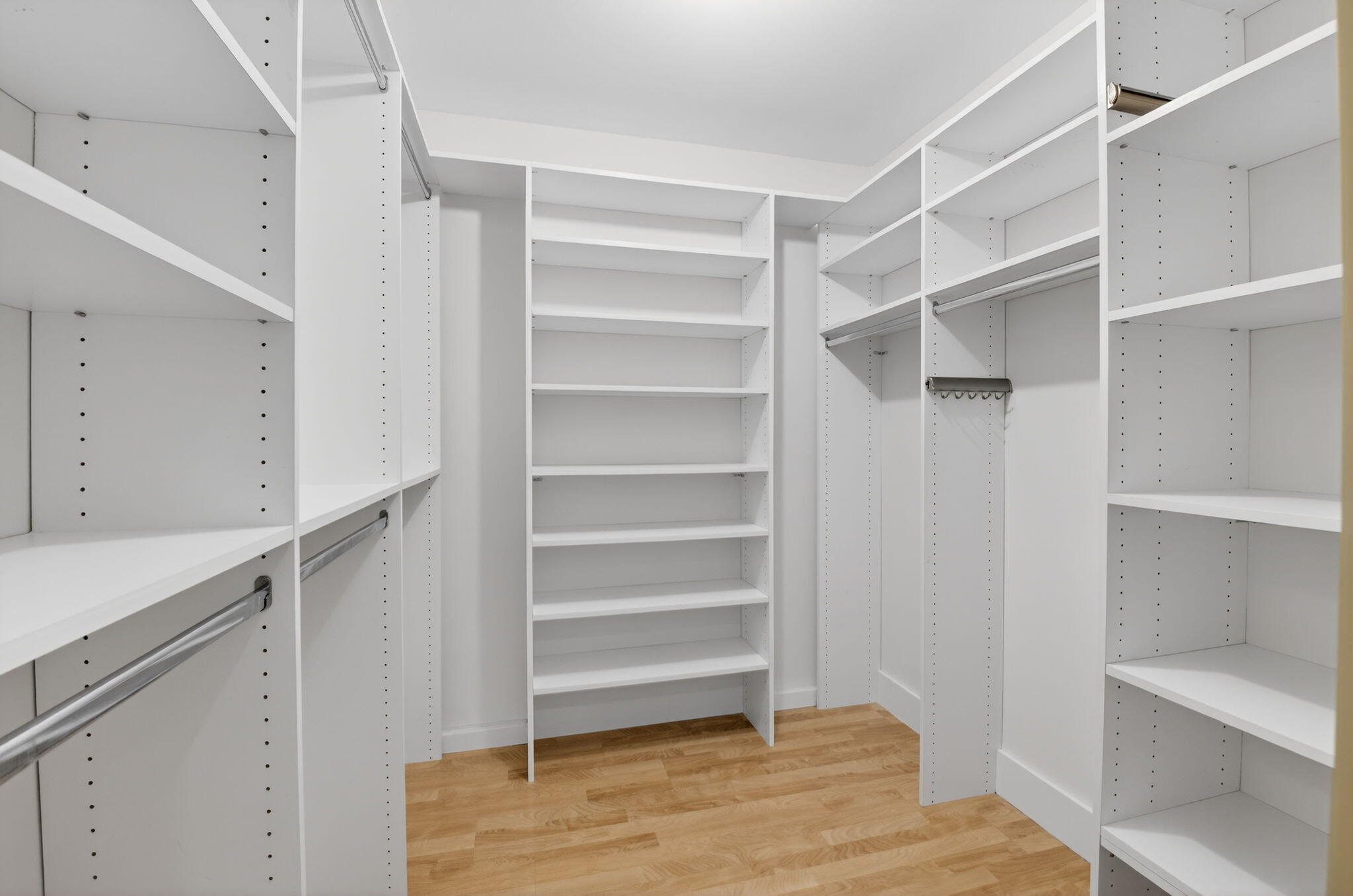 5845 Fox Hollow Drive, Unit A Boca Raton, FL 33486 - Photo 16 of 50 a view of walk in closet with empty racks