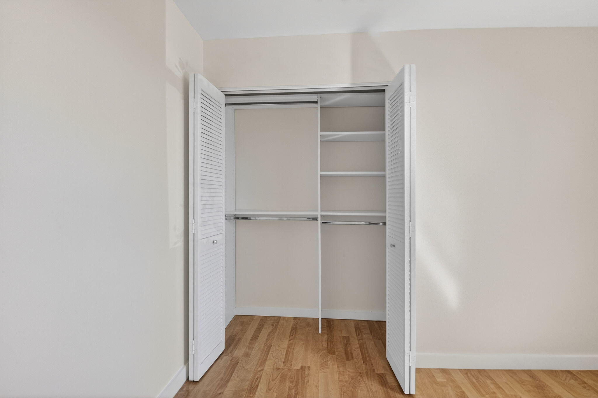 5845 Fox Hollow Drive, Unit A Boca Raton, FL 33486 - Photo 18 of 50 a view of walk in closet with empty racks