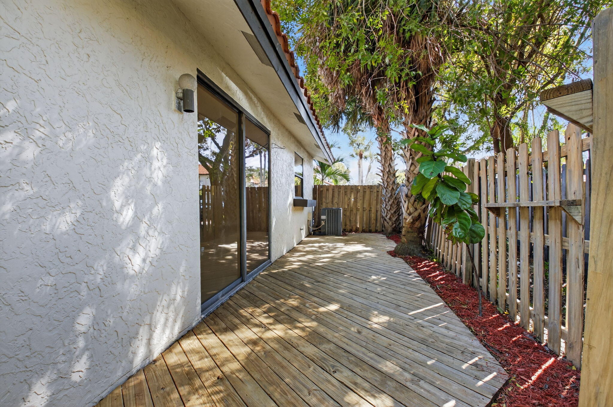 5845 Fox Hollow Drive, Unit A Boca Raton, FL 33486 - Photo 22 of 50 a view of a house with a backyard