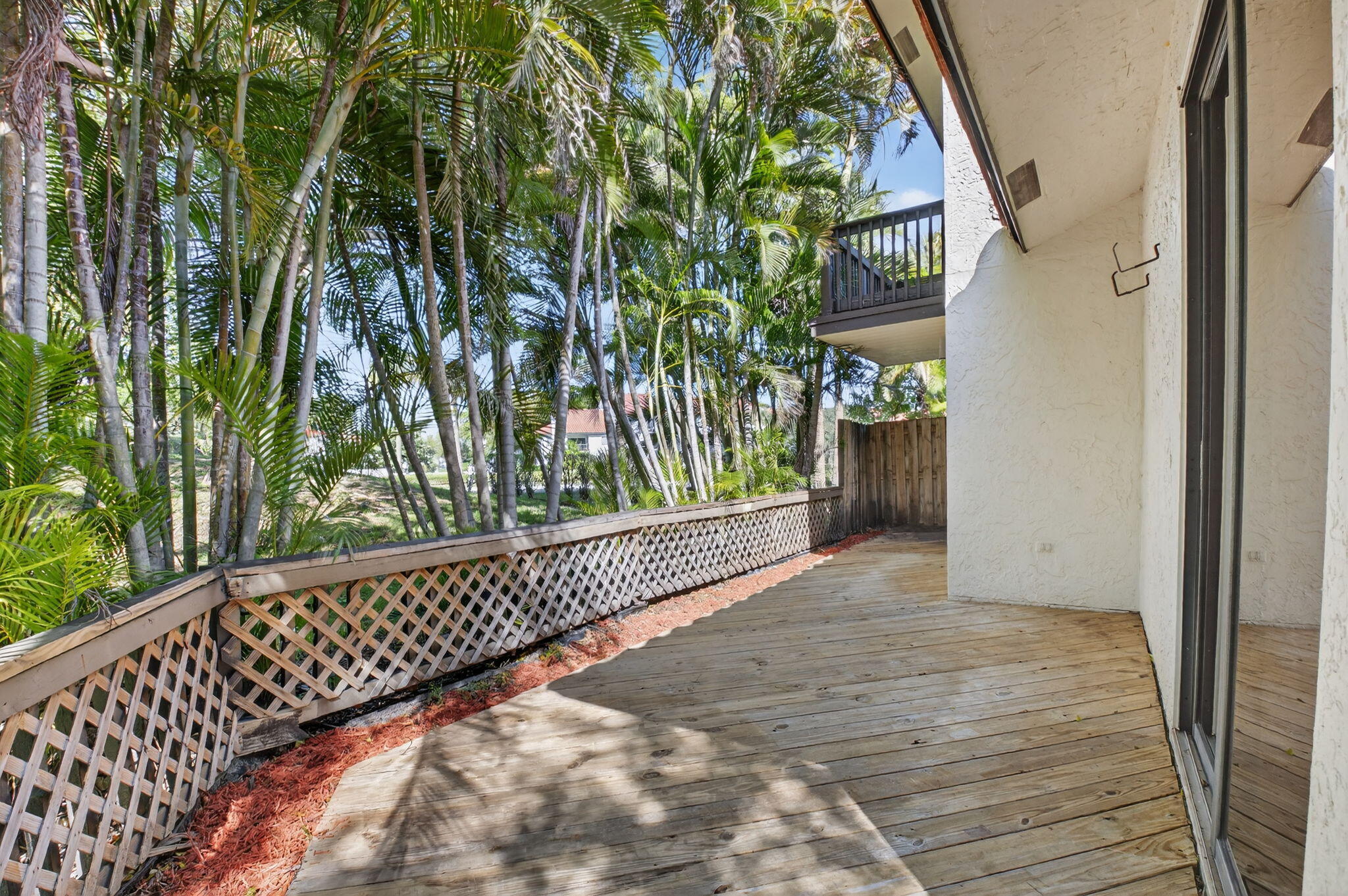 5845 Fox Hollow Drive, Unit A Boca Raton, FL 33486 - Photo 24 of 50 a view of a wooden fence