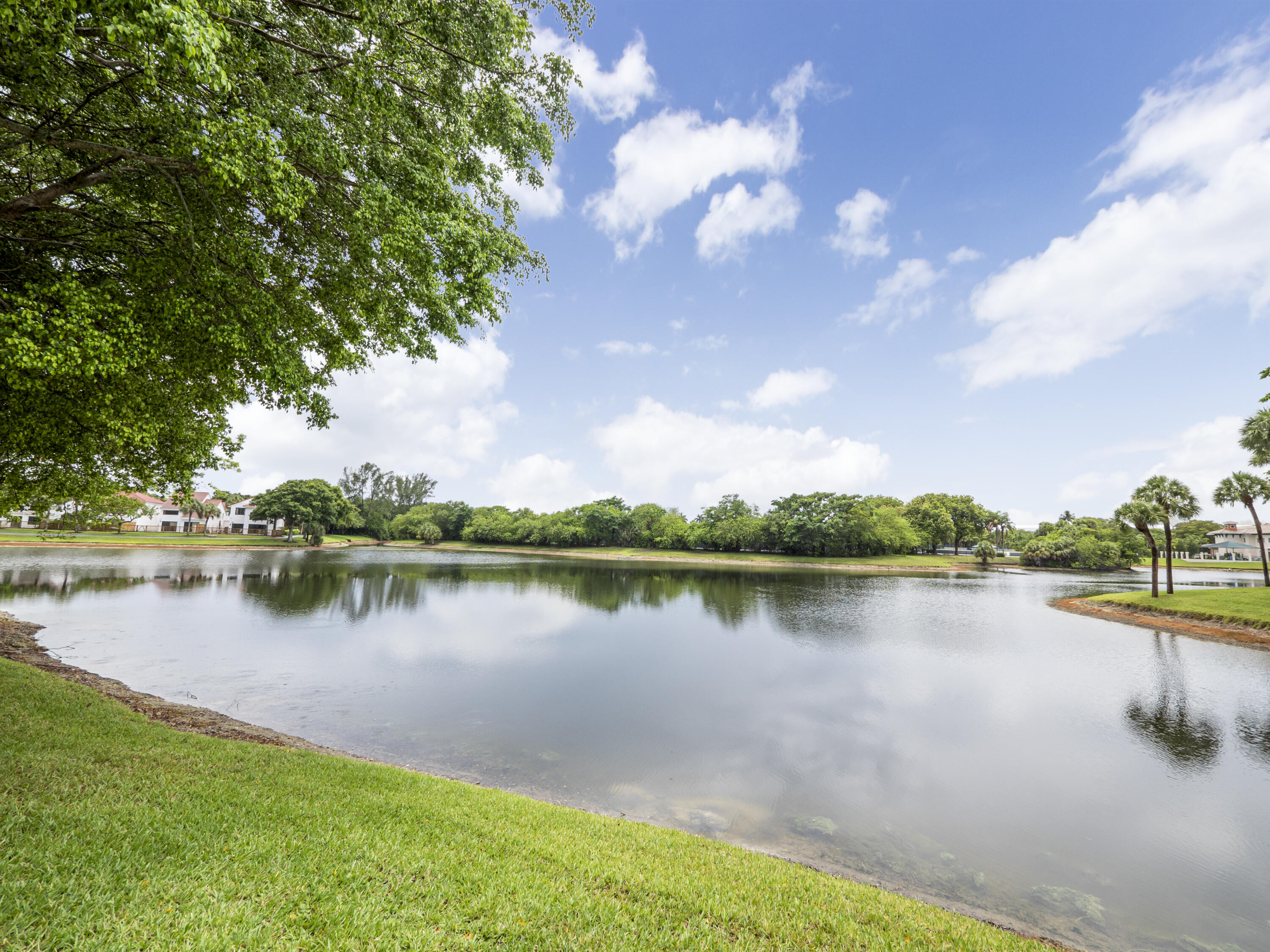 5845 Fox Hollow Drive, Unit A Boca Raton, FL 33486 - Photo 34 of 50 a view of a lake with a lake in the background