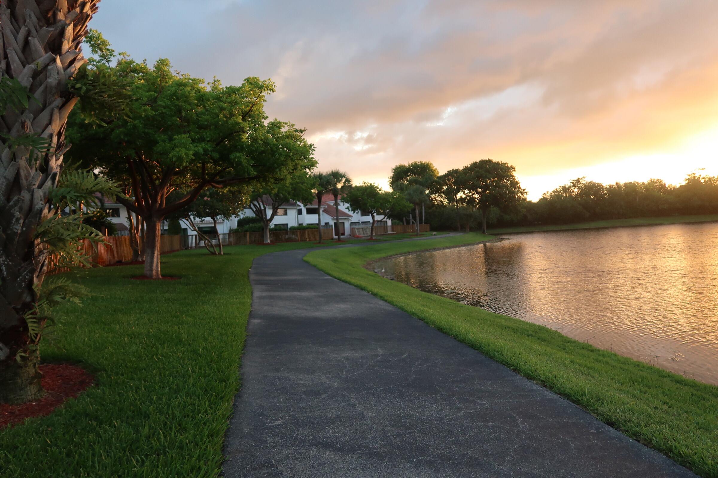 5845 Fox Hollow Drive, Unit A Boca Raton, FL 33486 - Photo 35 of 50 a view of a lake with a big yard