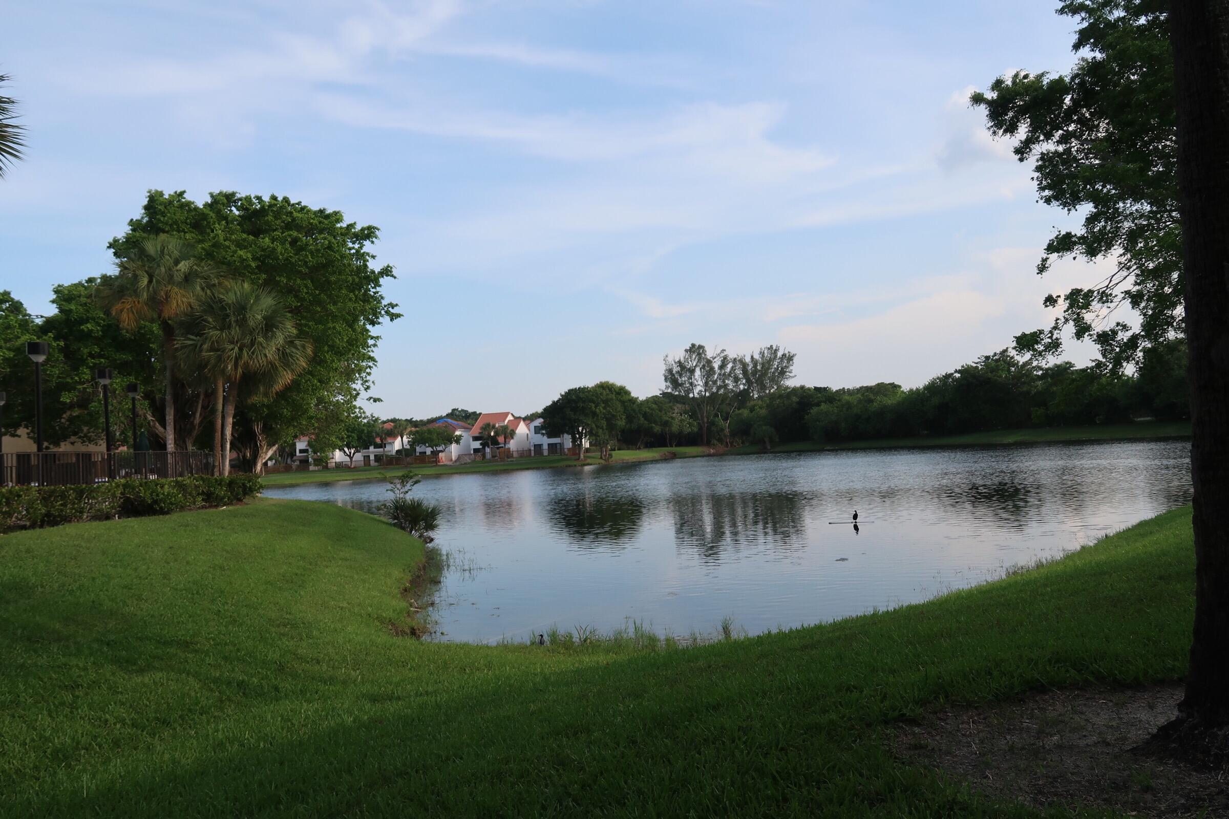 5845 Fox Hollow Drive, Unit A Boca Raton, FL 33486 - Photo 36 of 50 a view of lake with green space