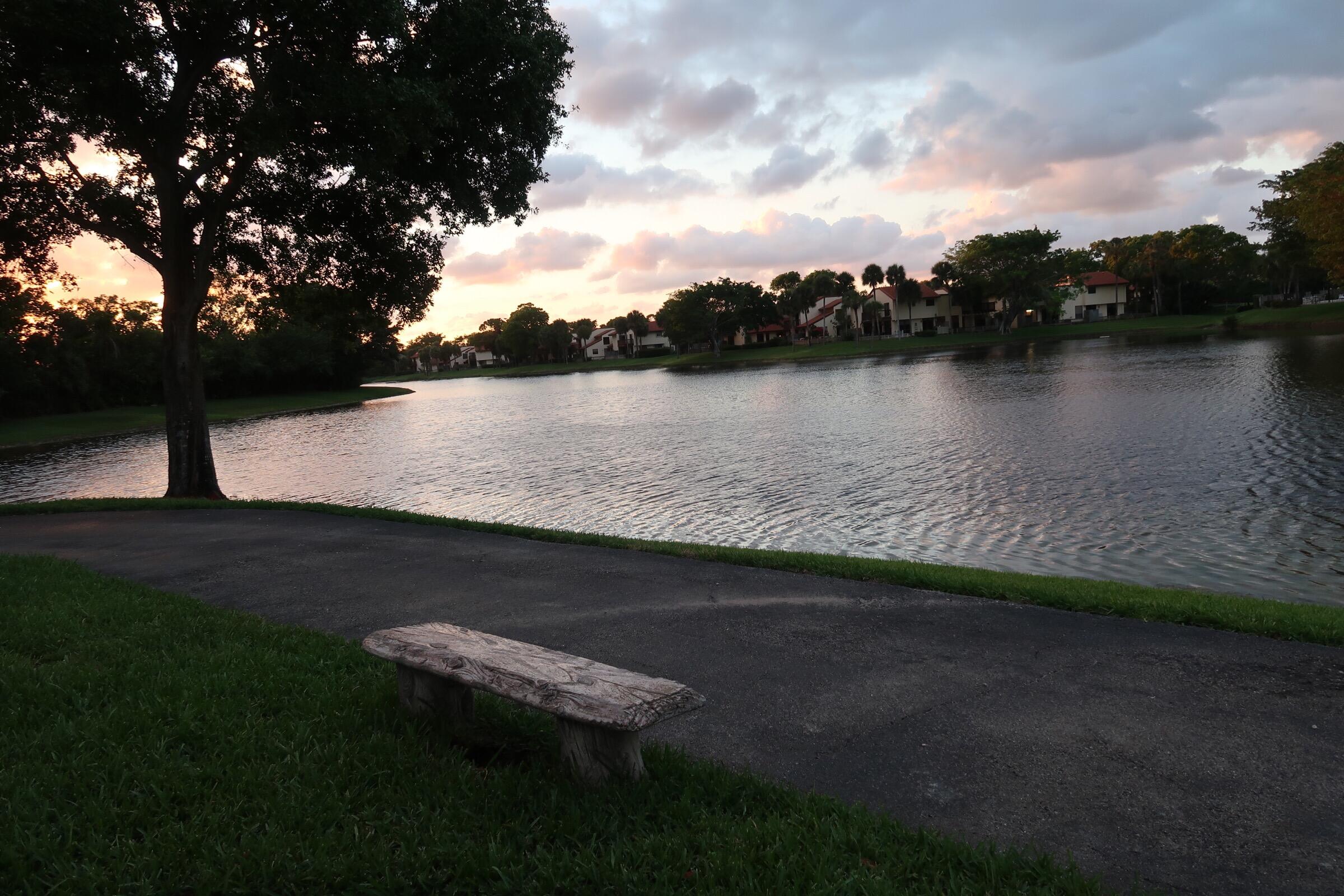 5845 Fox Hollow Drive, Unit A Boca Raton, FL 33486 - Photo 39 of 50 a view of a lake from a yard