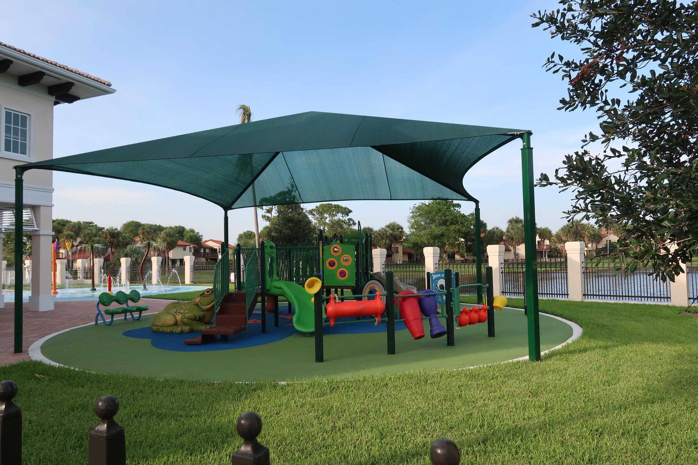 5845 Fox Hollow Drive, Unit A Boca Raton, FL 33486 - Photo 44 of 50 a yellow and red umbrella sitting in front of a house