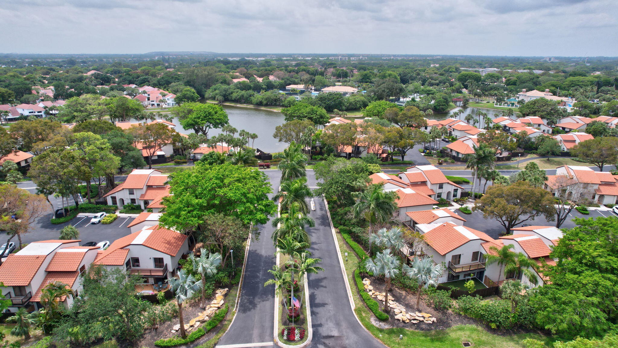 5845 Fox Hollow Drive, Unit A Boca Raton, FL 33486 - Photo 48 of 50 an aerial view of multiple house